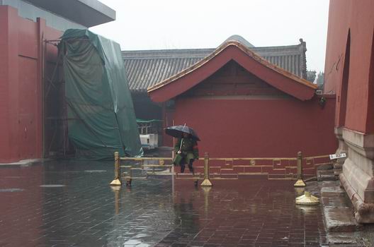 A lonely soldier in the rain near The Forbidden City.