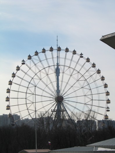 View of the 75 meter tall ferries wheel at the former VDNH (????) exhibition center and behind that in the distance the 540 meter tall Ostankino TV tower. The picture is taken from the platform of the station on Sergey Eyzenshteyn's street.